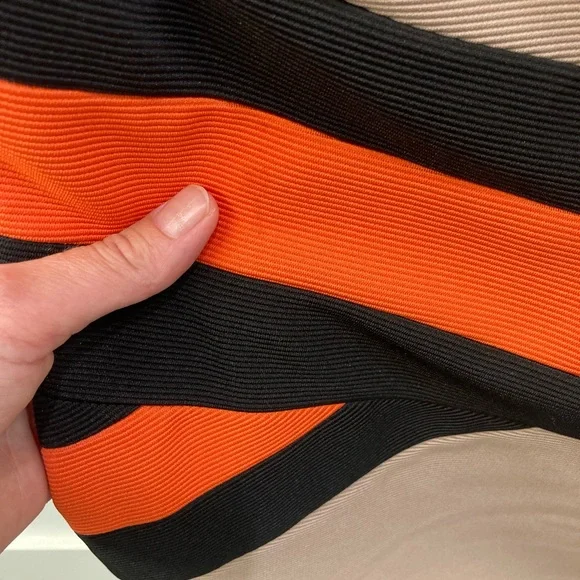 Tan bandage dress with bright orange and black waist detailing. - Picture 6 of 7
